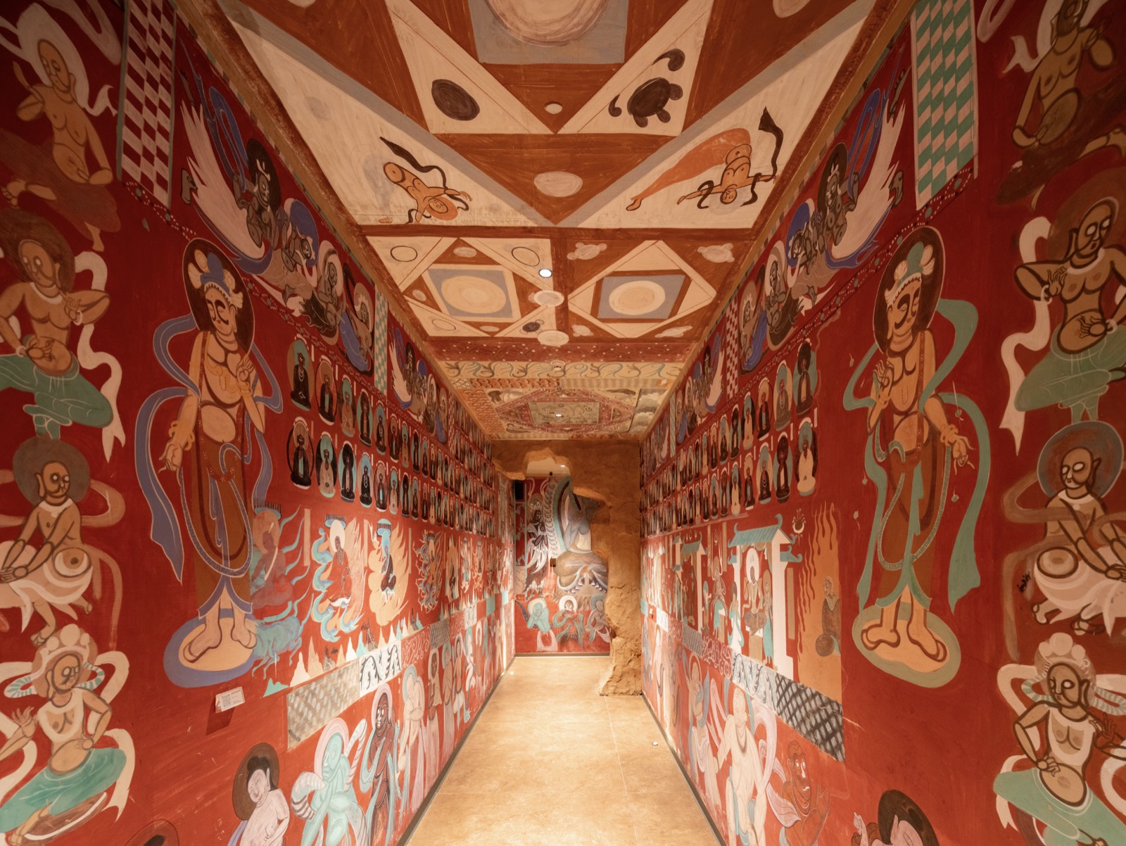 Hand-painted Dunhuang grotto walls inside the galleries