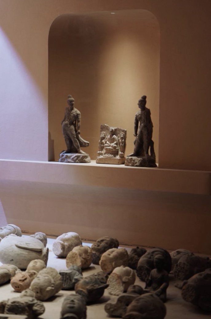 Sculpture against the sandstone wall