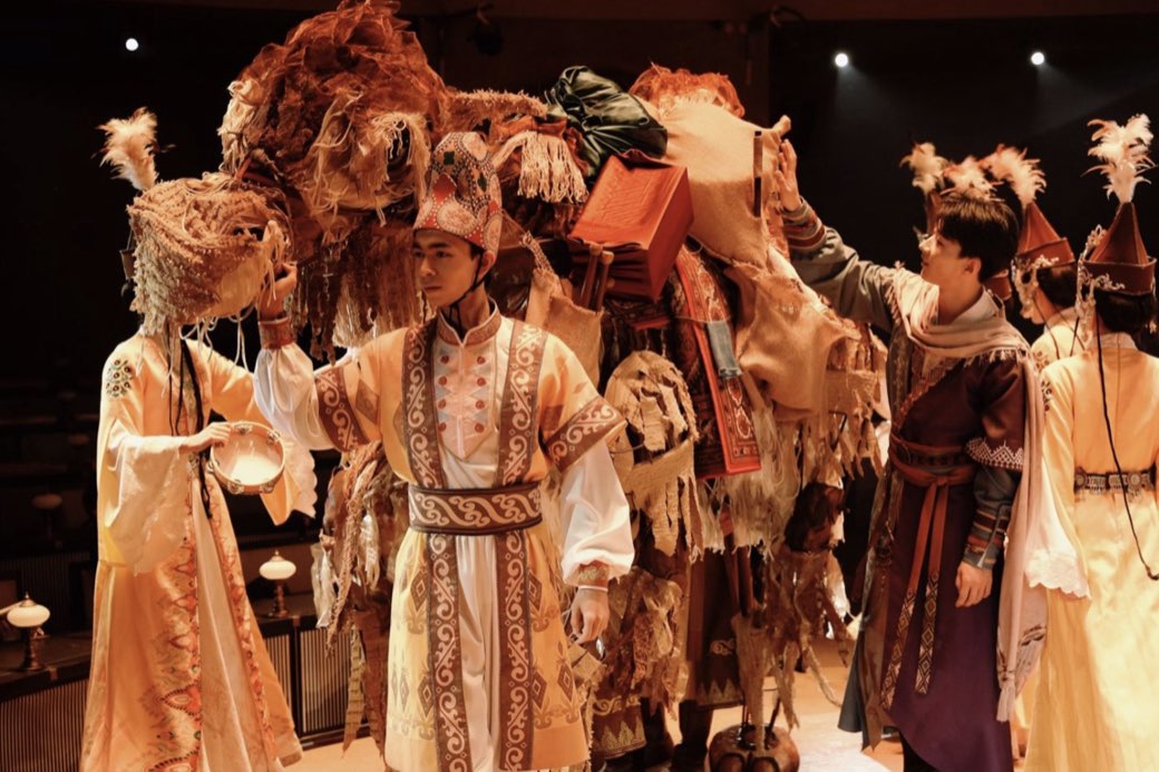 A merchant caravan crossing the stage