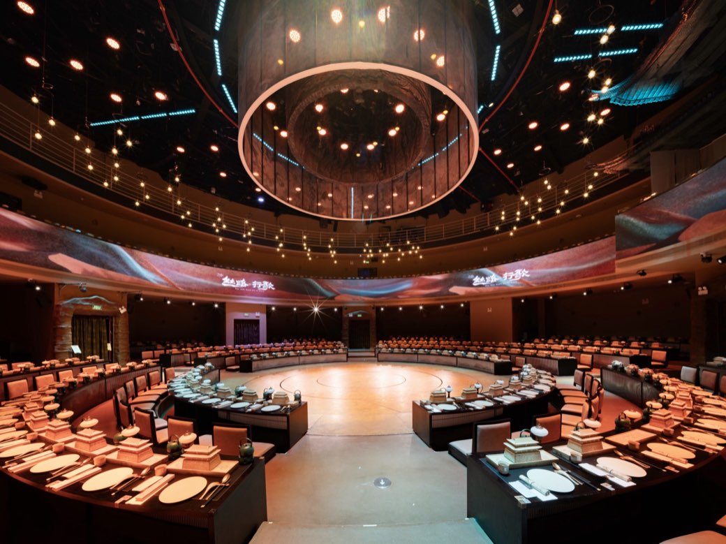 The round theatre, laid for service before the doors open