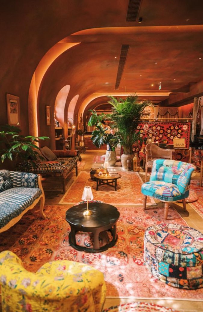 The bohemian lounge with rugs and arches