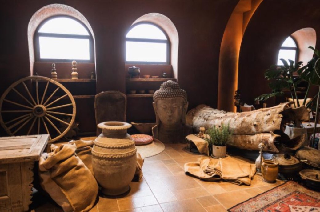 Arched windows, a stone Buddha and Silk Road pottery
